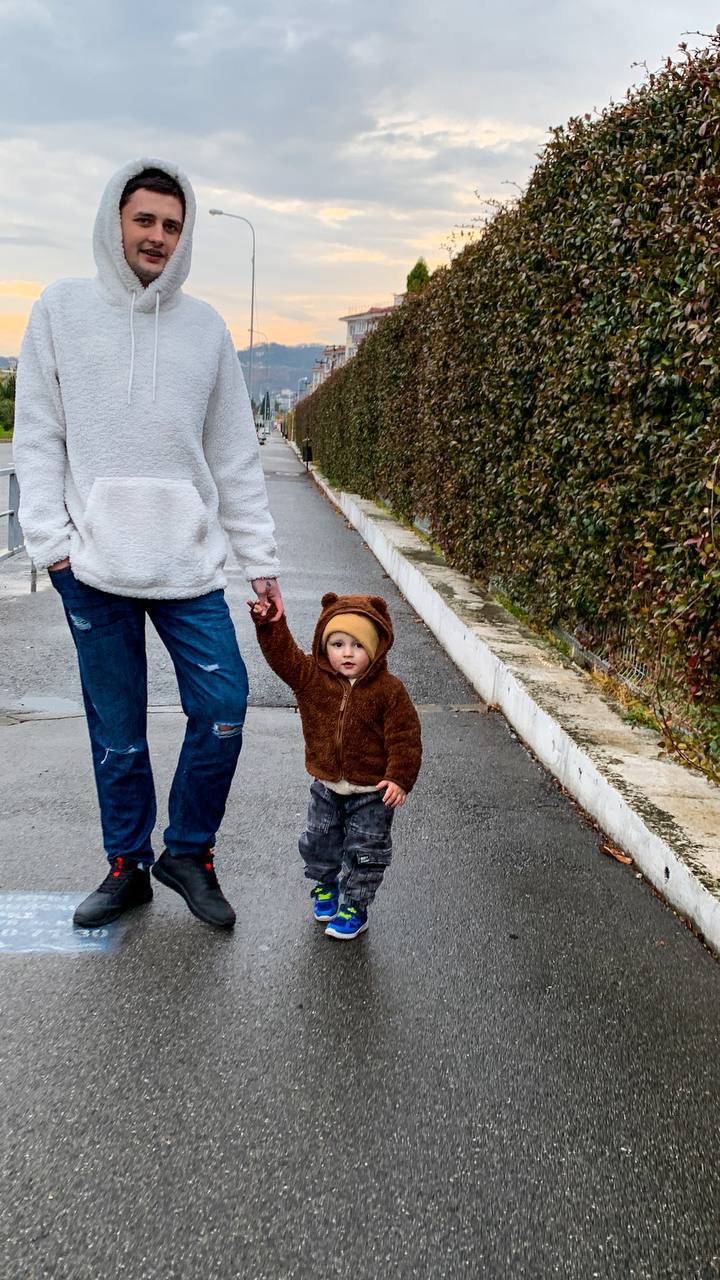Igor walking with his son Adam at sunset